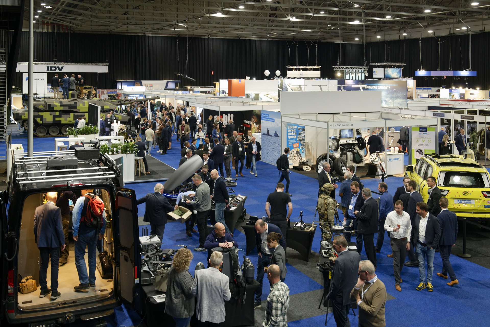 overview of exhibition floor with people and stands